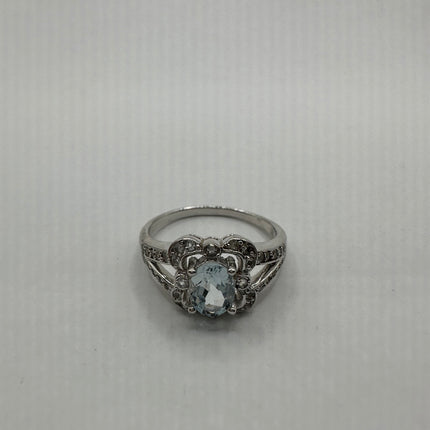 Pale blue aquamarine surrounded by white sapphires set in 925 sterling silver