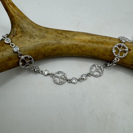 delicate link together peace signs very small about a half inch wide simple diamond cubic zirconia